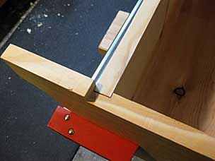 Realizing the bottom board should not be flush with the notch in the sides