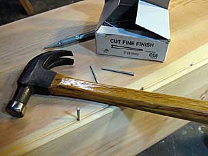 Nailing side to bottom of six board chest