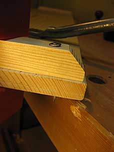 Nail through batten and lid