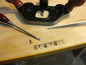 Lock strike on lid of boarded chest