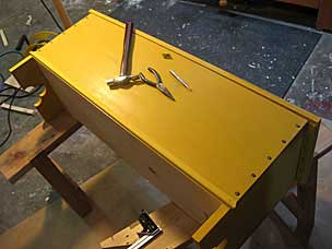 Installing skirt moulding on front of boarded chest