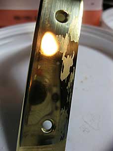 Brass cornerguards with stripping gel residue