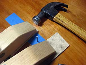 Setting up to drive nail through top into batten