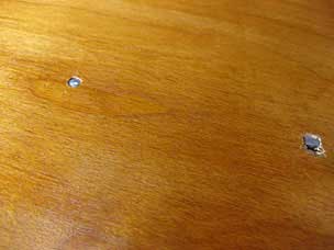 Nails through top into batten