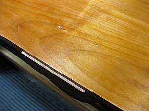 Nails through top into batten