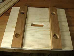 Tapered mortises in staked stool ready for assembly
